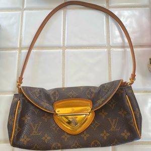 Louis Vuitton clutch with strap